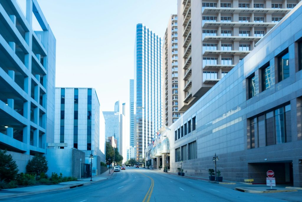 City street lined with tall apartment and office buildings